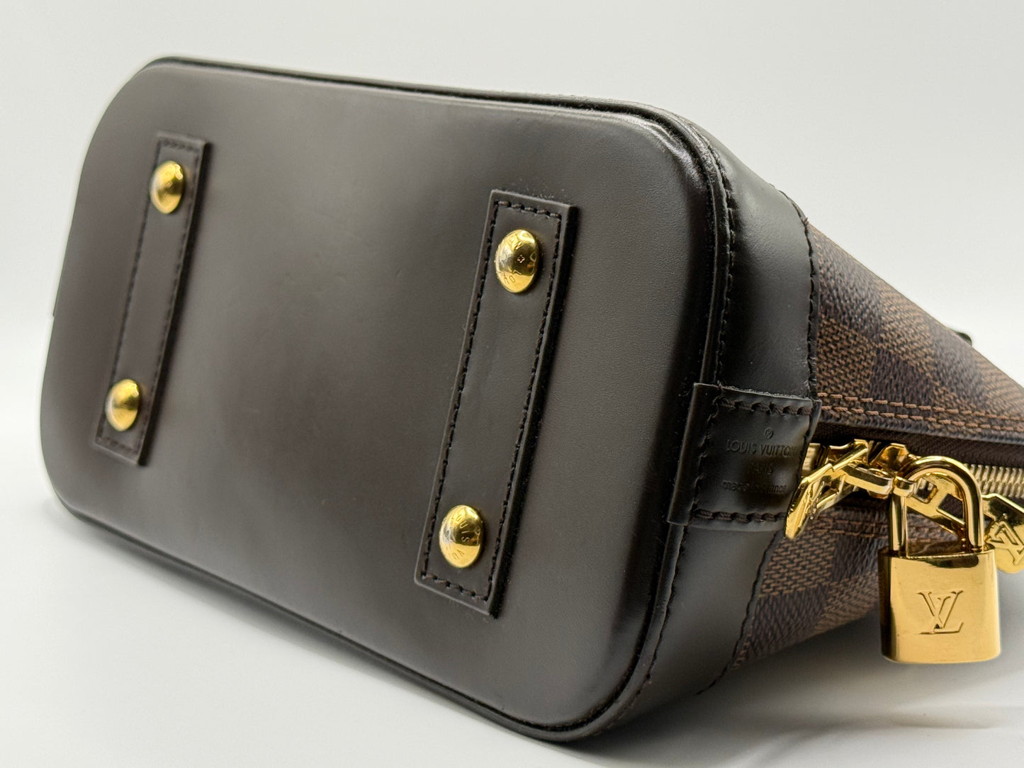 Louis Vuitton Alma BB Damier Ebène, rear view with smooth coated canvas and contrast stitching detail
