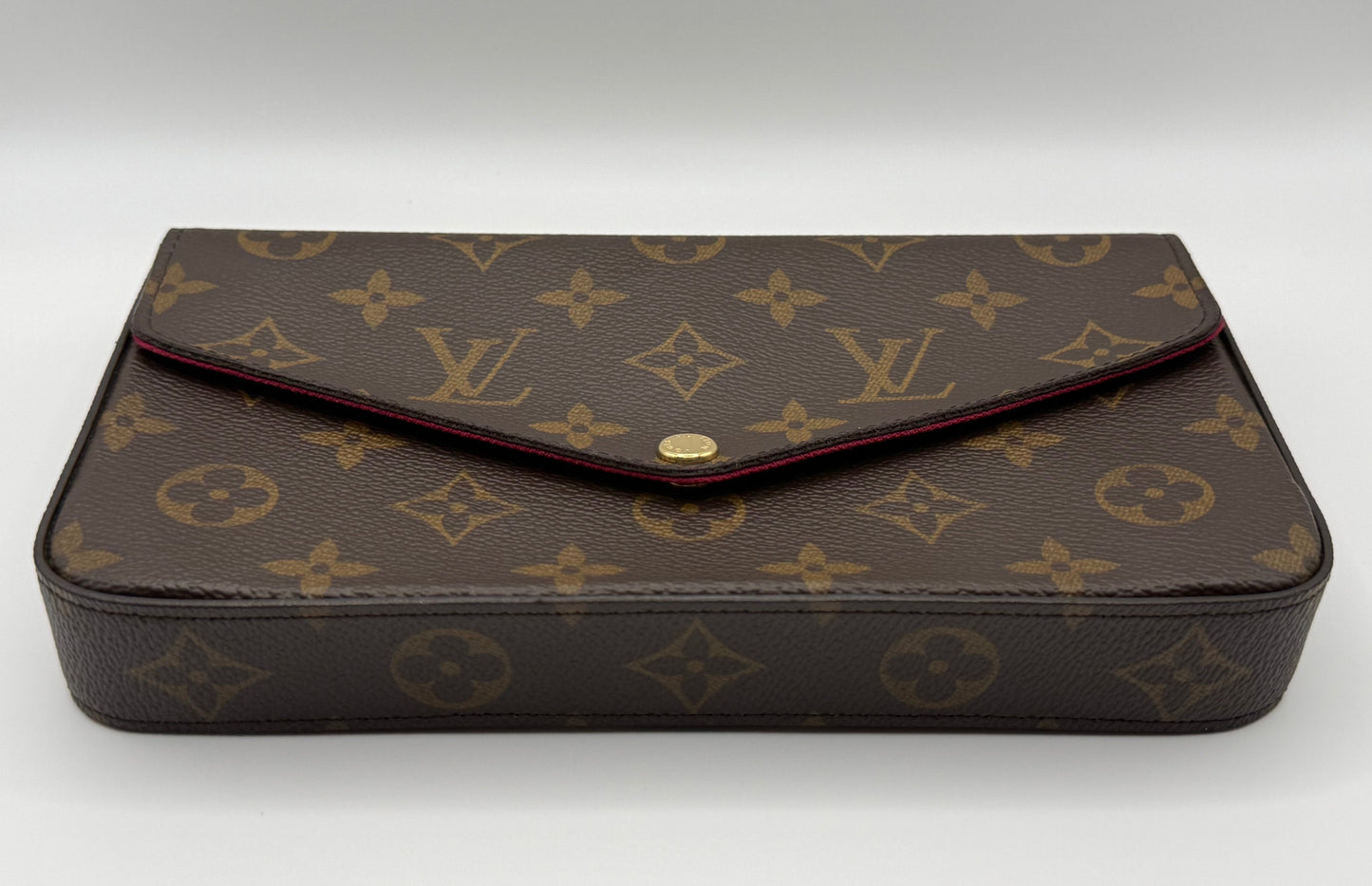 Louis Vuitton Félicie Pochette front view showing Monogram canvas pattern and gold snap closure