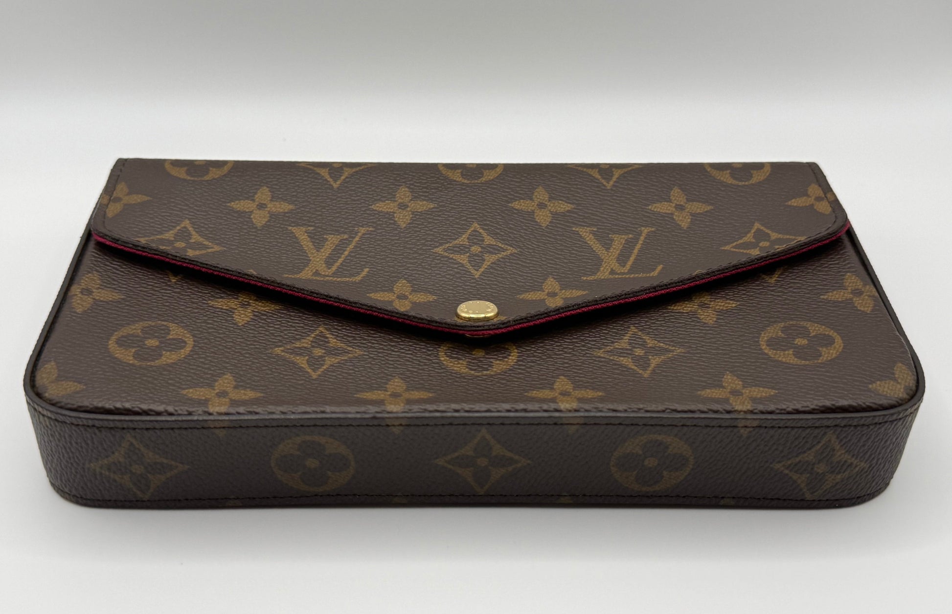 Louis Vuitton Félicie Pochette front view showing Monogram canvas pattern and gold snap closure