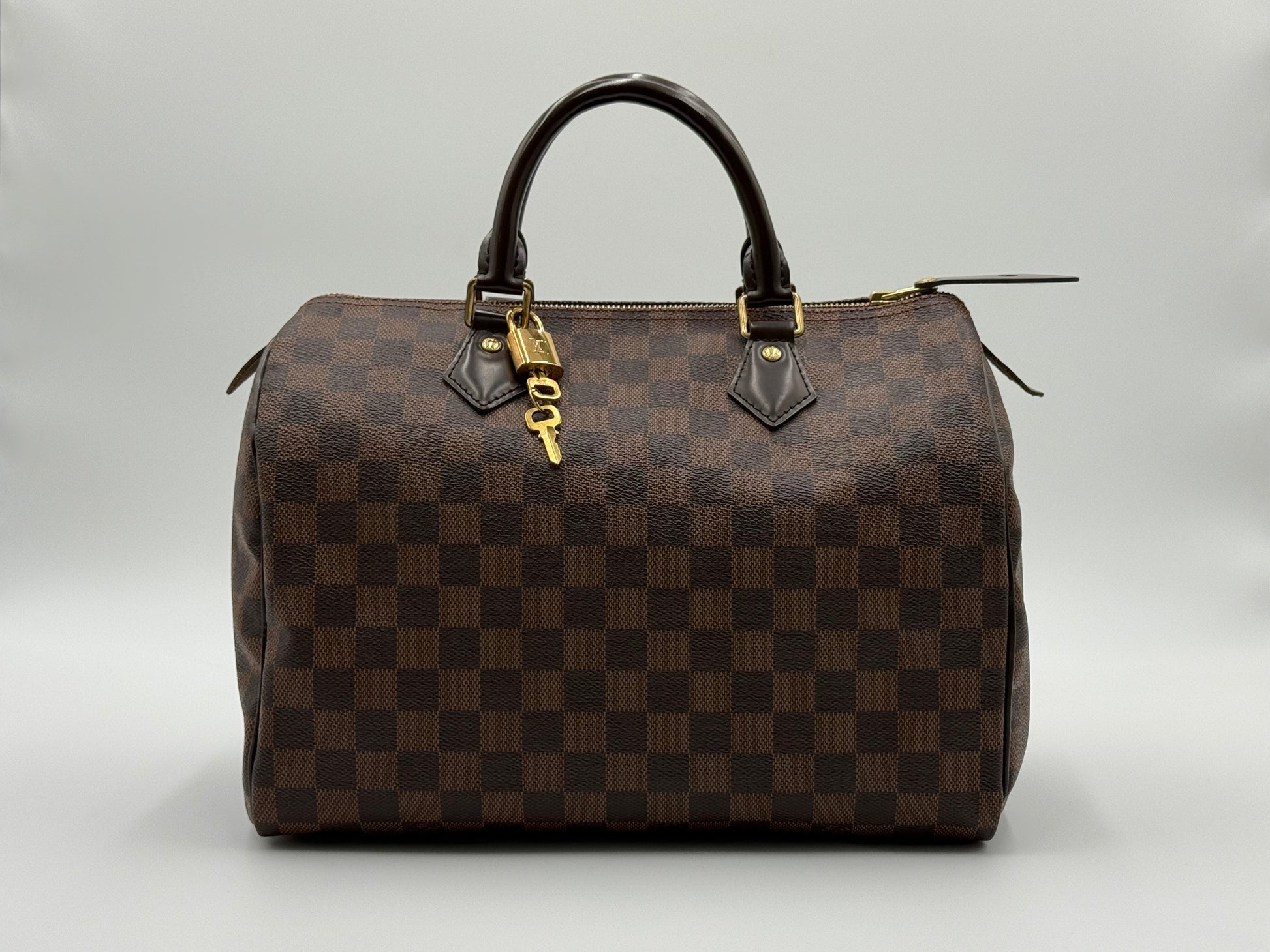 Louis Vuitton Speedy 30 in Damier Ebène canvas with gold-tone hardware, pre-owned and authenticated by Śhanta Dubai