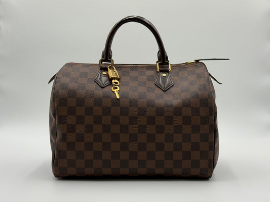 Louis Vuitton Speedy 30 in Damier Ebène canvas with gold-tone hardware, pre-owned and authenticated by Śhanta Dubai
