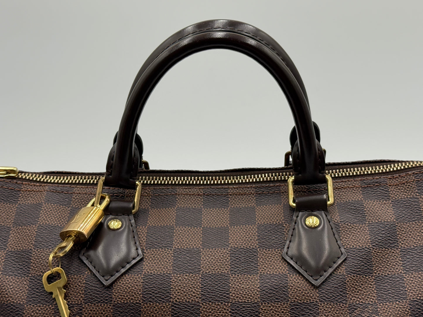 Louis Vuitton Speedy 30 leather handles with gold padlock and key attached