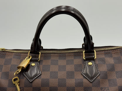 Louis Vuitton Speedy 30 leather handles with gold padlock and key attached