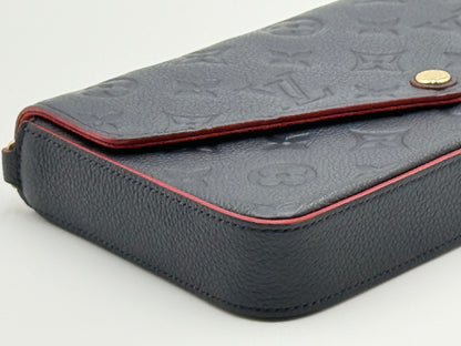 Louis Vuitton Félicie Pochette Empreinte Marine Rouge — angled side view showing red edge paint