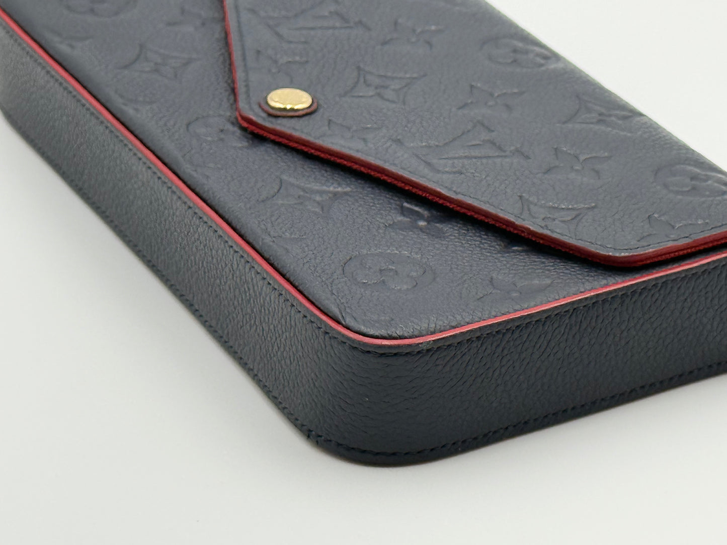 Louis Vuitton Félicie Pochette Empreinte Marine Rouge — flap and gold snap detail