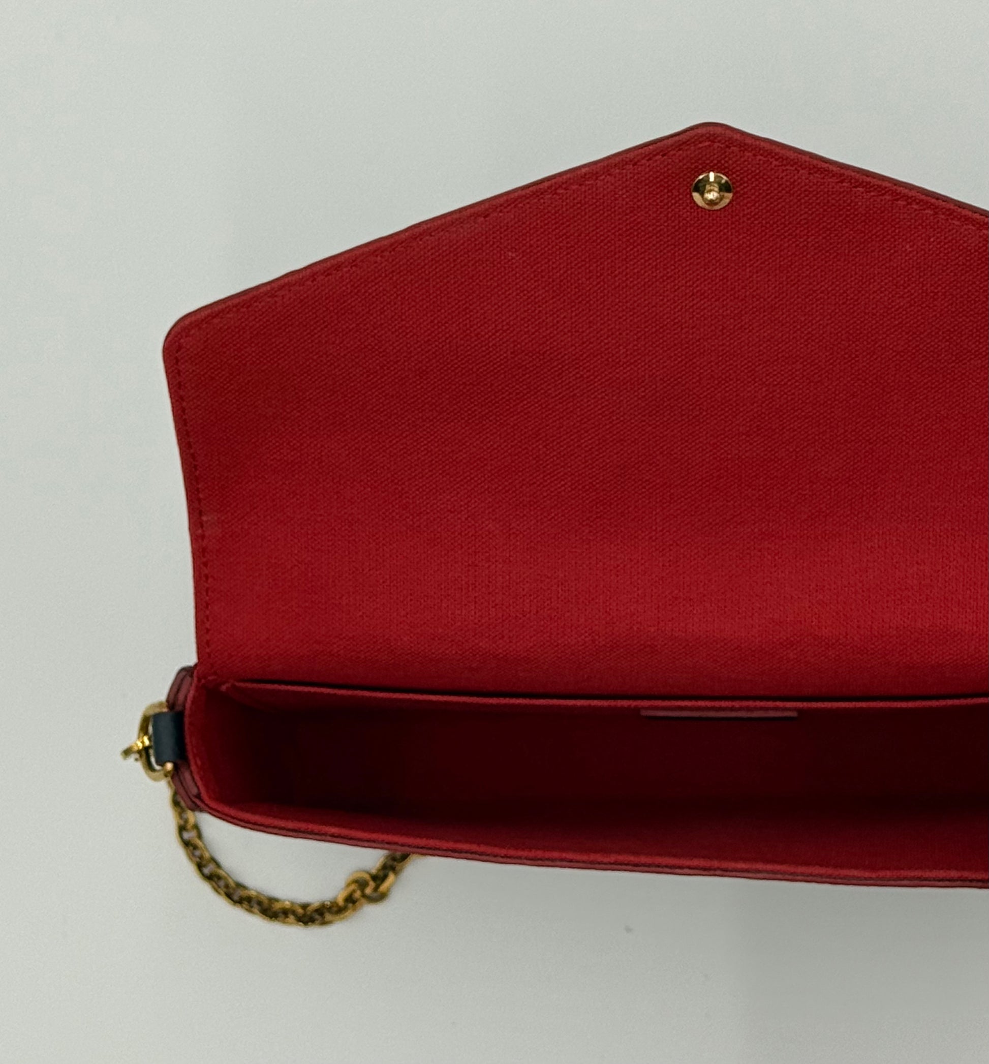Louis Vuitton Félicie Pochette Empreinte Marine Rouge — interior compartment and chain attachment