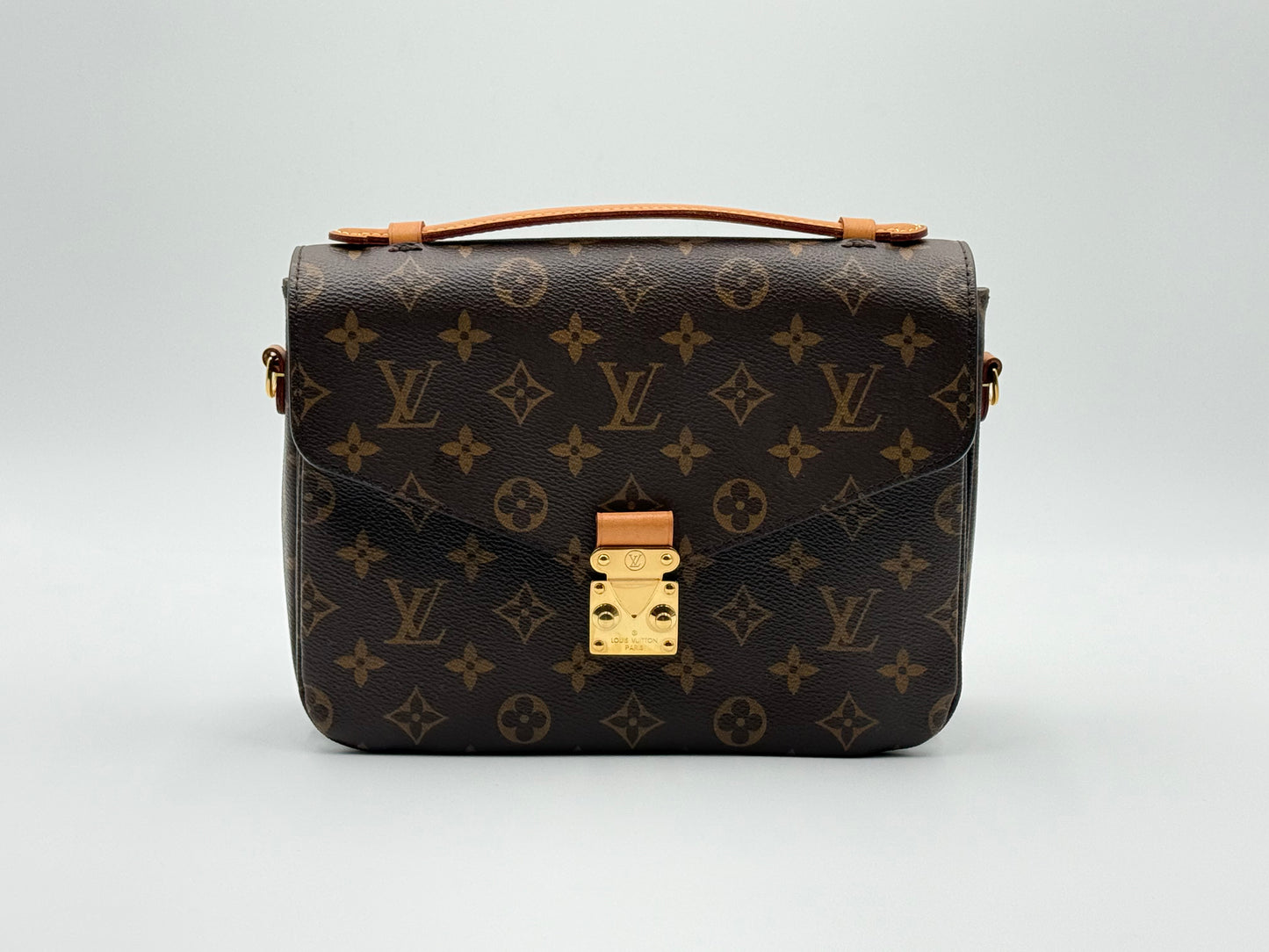 Louis Vuitton Pochette Métis Monogram — front view with S-lock closure and top handle