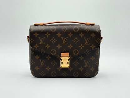 Louis Vuitton Pochette Métis Monogram — front view with S-lock closure and top handle