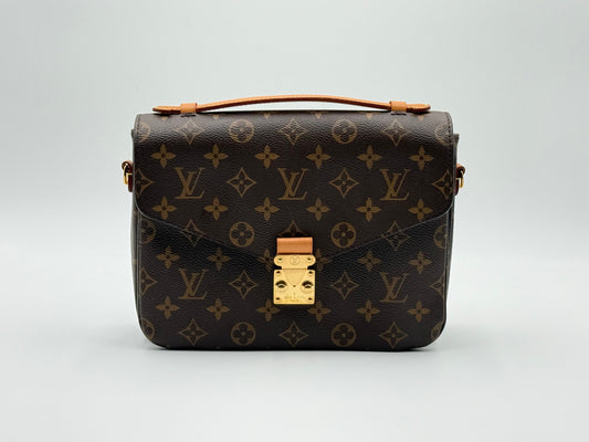 Louis Vuitton Pochette Métis Monogram — front view with S-lock closure and top handle