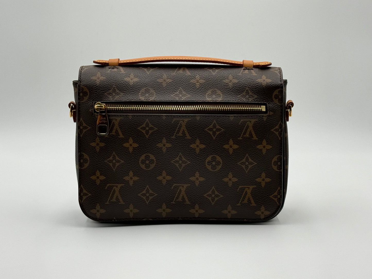 Louis Vuitton Pochette Métis Monogram — back view with exterior zip pocket
