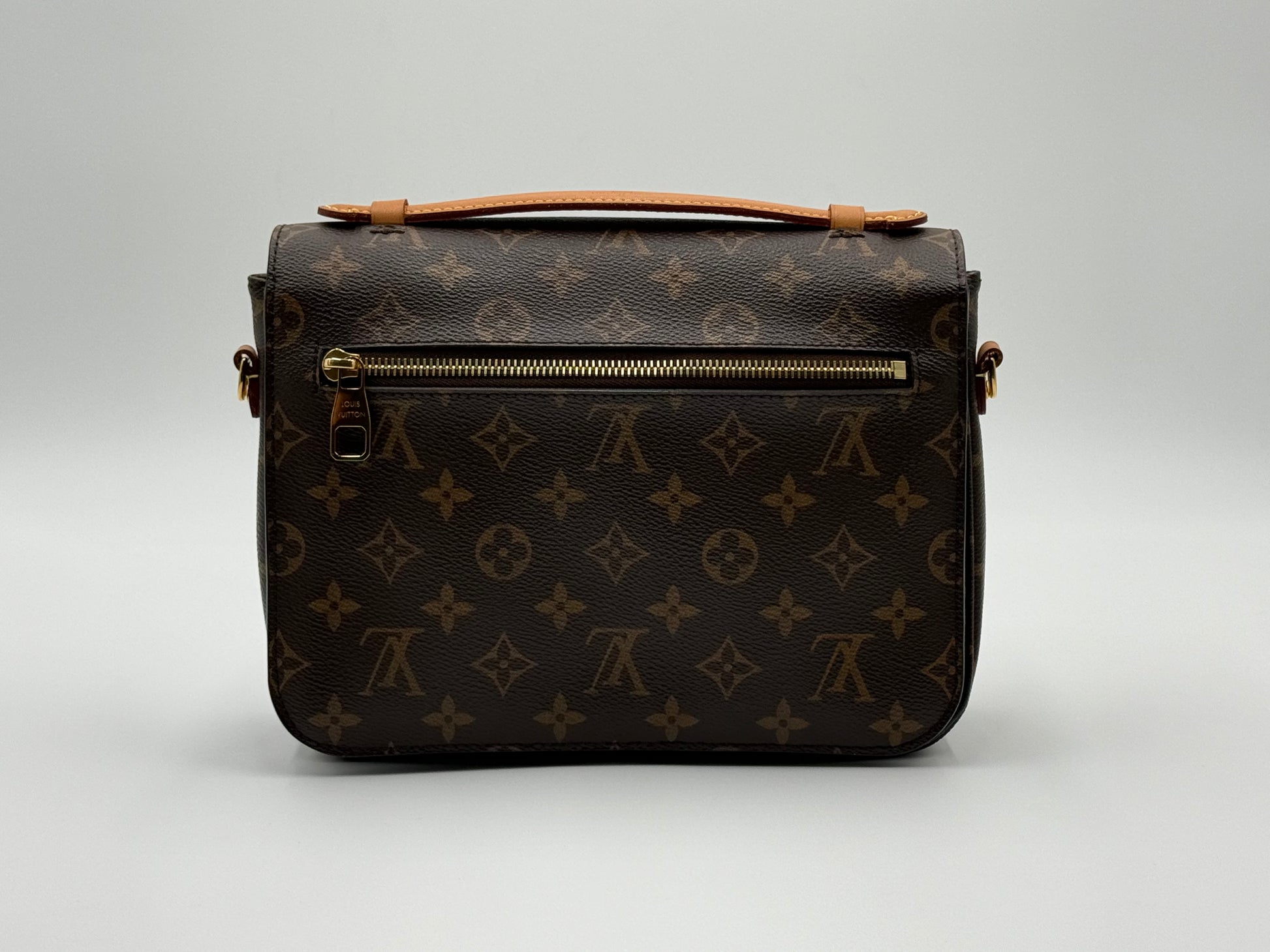 Louis Vuitton Pochette Métis Monogram — back view with exterior zip pocket