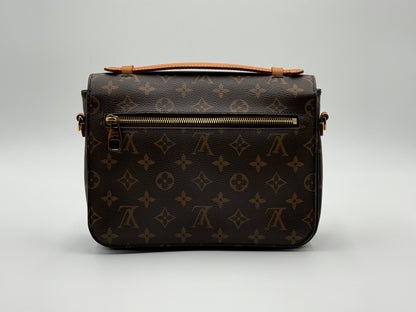 Louis Vuitton Pochette Métis Monogram — back view with exterior zip pocket
