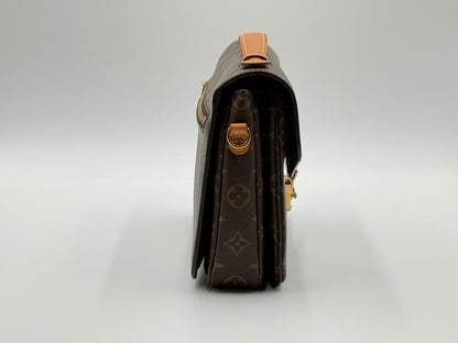 Louis Vuitton Pochette Métis Monogram — angled front view with adjustable leather strap