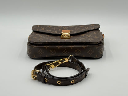 Louis Vuitton Pochette Métis Monogram — flap and S-lock from above