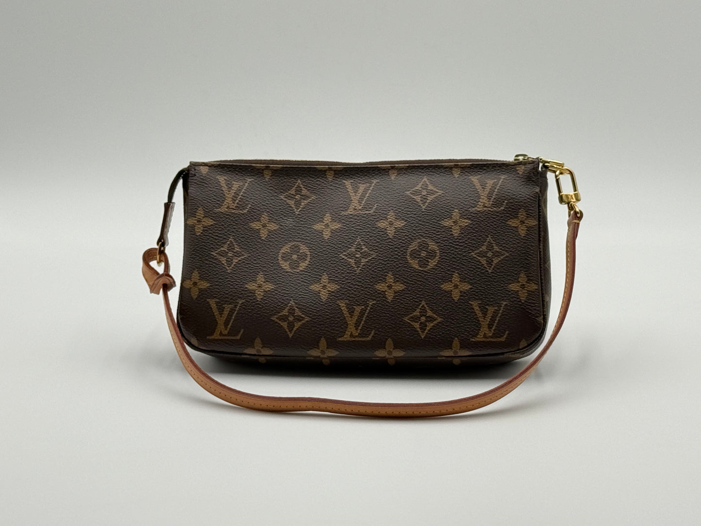Louis Vuitton Pochette Accessoires Monogram — front view with vachetta leather strap