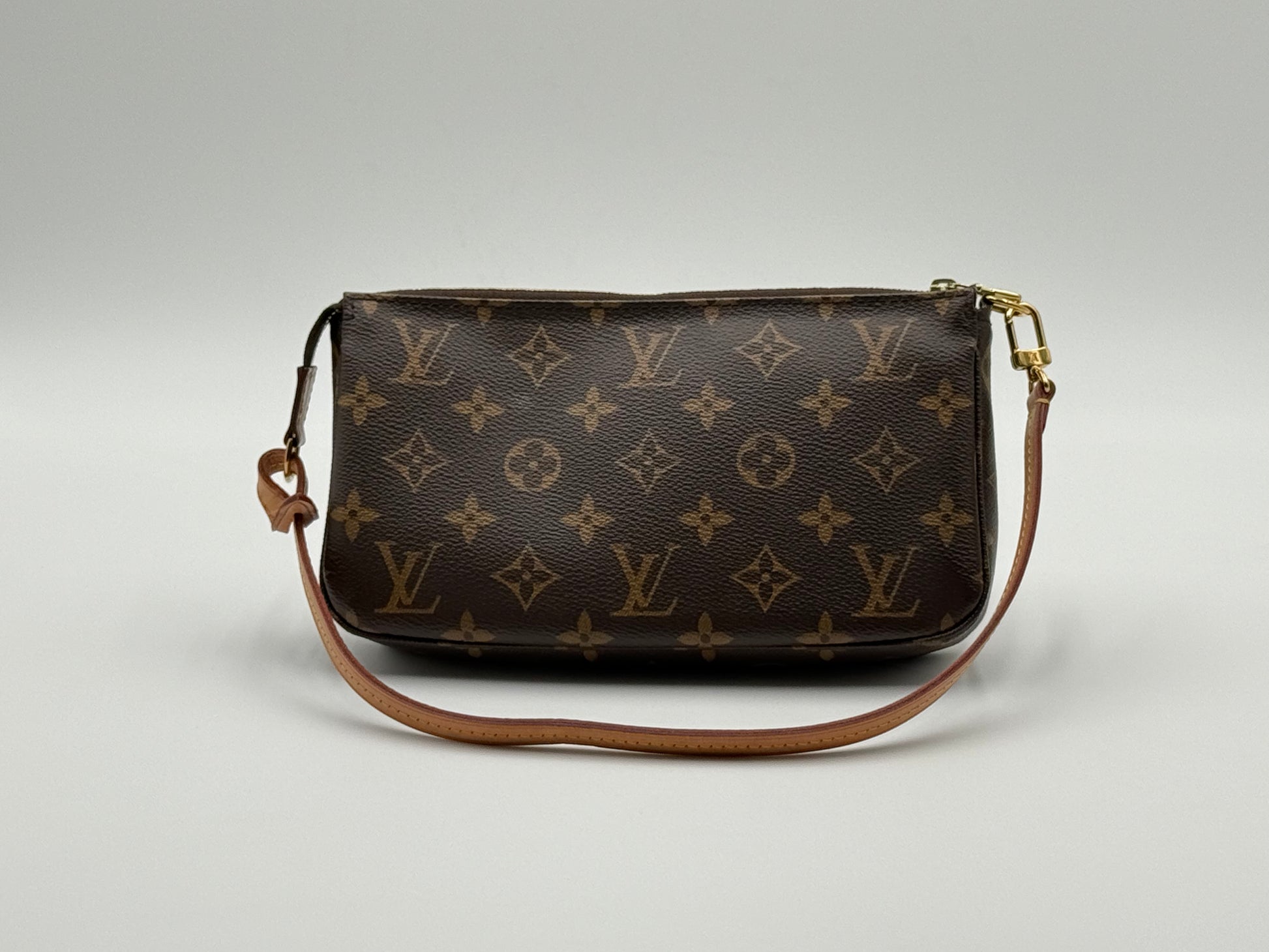 Louis Vuitton Pochette Accessoires Monogram — front view with vachetta leather strap