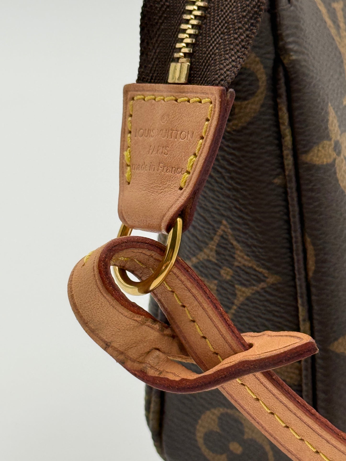 Louis Vuitton Pochette Accessoires Monogram — vachetta tab with Made in France heat stamp