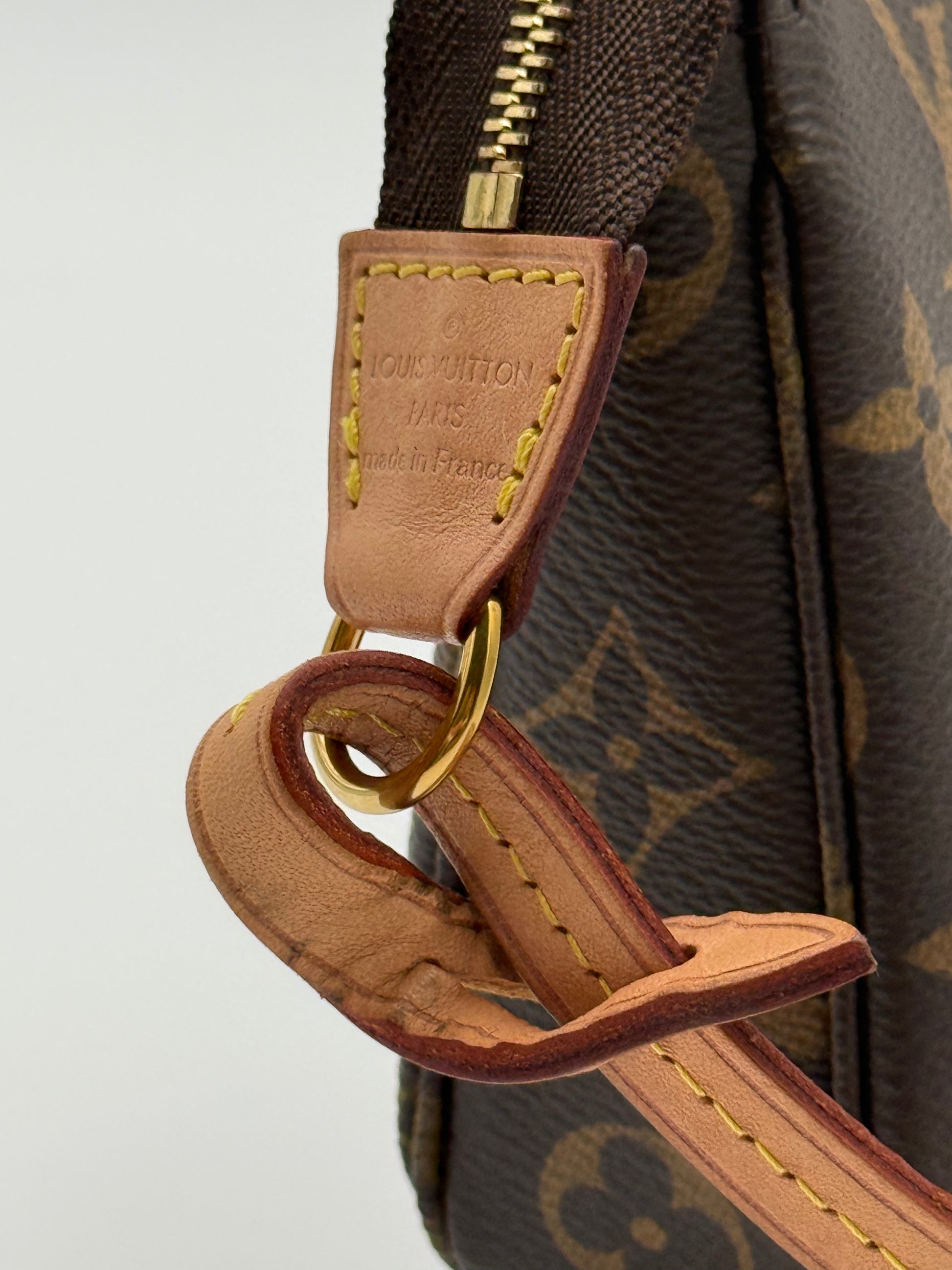 Louis Vuitton Pochette Accessoires Monogram — vachetta tab with Made in France heat stamp