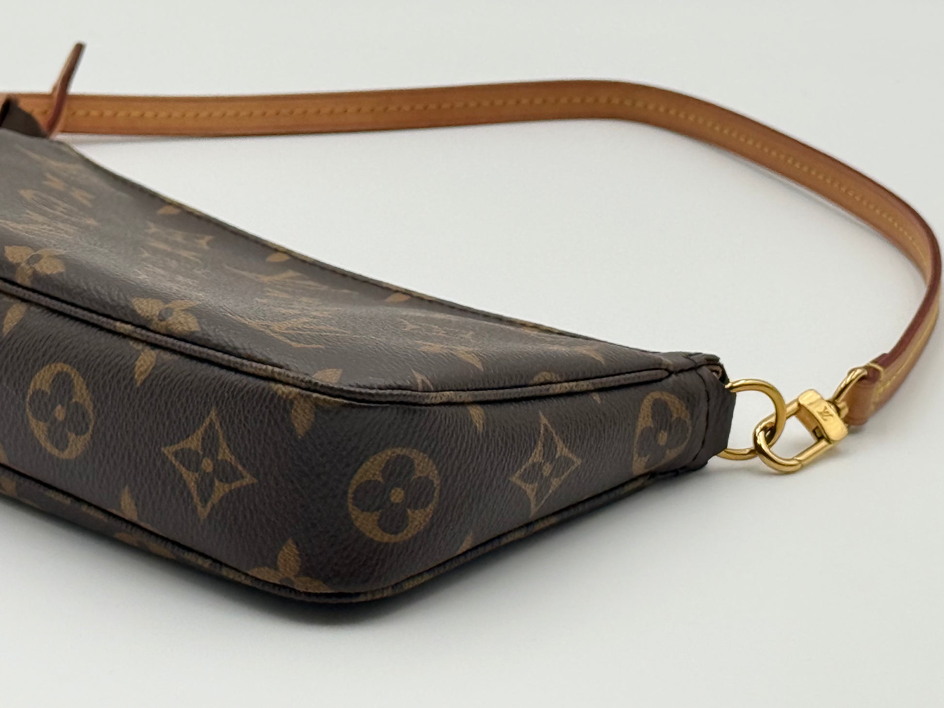 Louis Vuitton Pochette Accessoires Monogram — gold-tone clasp and zip pull detail